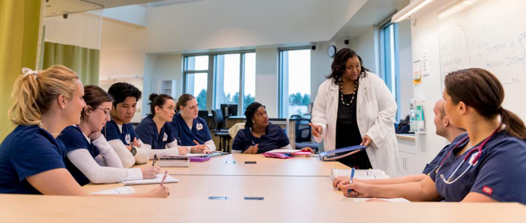 Nurses sitting around big table